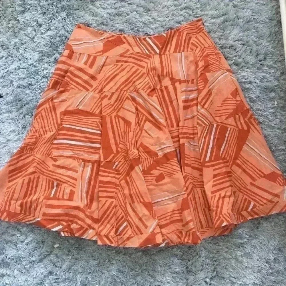 Anthropologie orange patterned midi‎ skirt